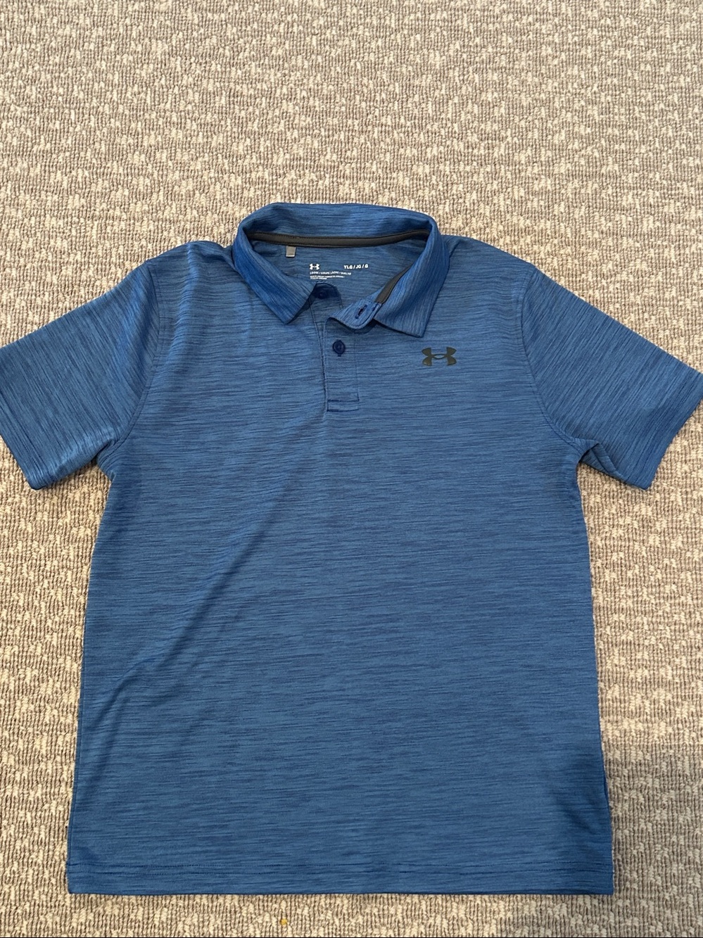 Under Armour blue polo shirt for boys. Size large.